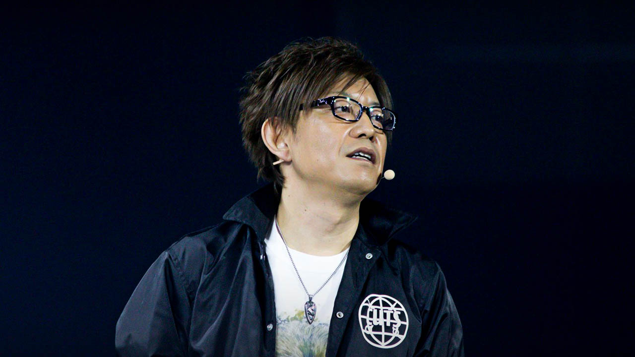 Naoki Yoshida on stage.
